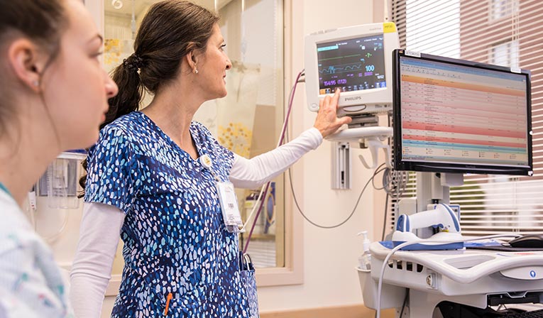 Medical staff looking at monitors